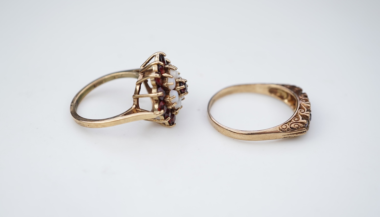 Two 19th century white metal mounted horn snuff mulls, one engraved 'John Calder', the other with inset tiger's eye quartz cabochon, both a.f., largest 83mm.